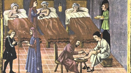 <p>Middeleeuwse afbeelding van de verzorging van zieken in een stedelijk gasthuis. </p>
